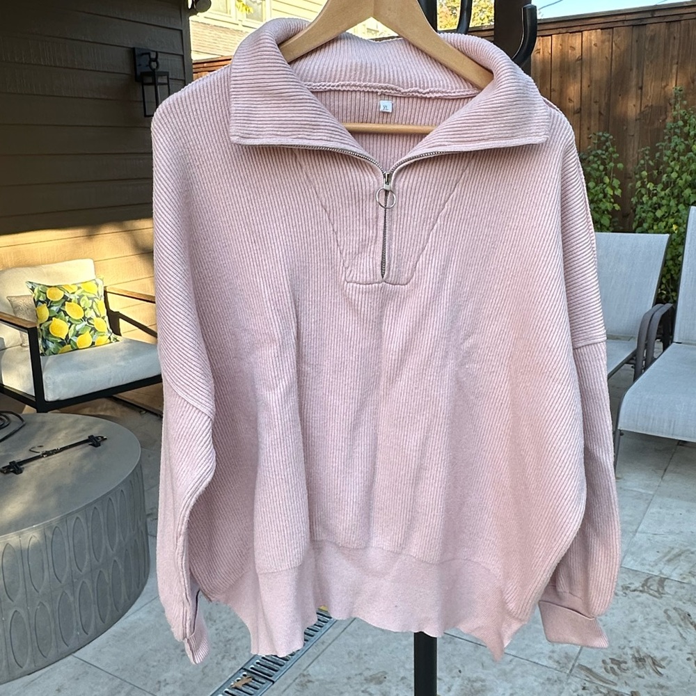 Pink half zip sweater.  Size xl.  A little wrinkled but in great condition.